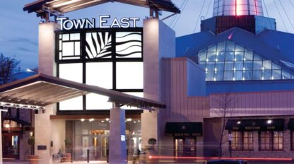 Twilight view of the town east mall entrance with illuminated signage.