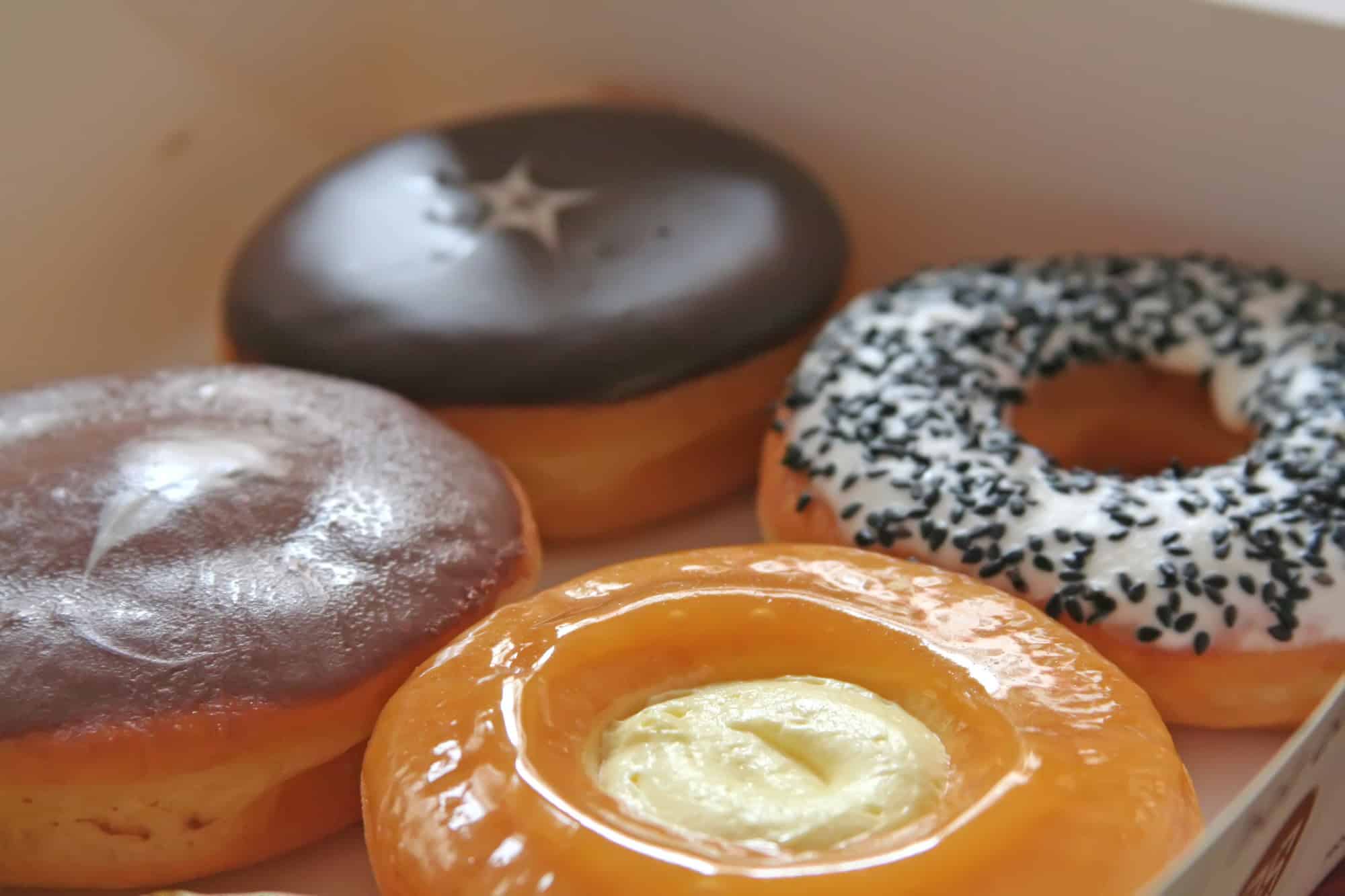 Four donuts in a box.