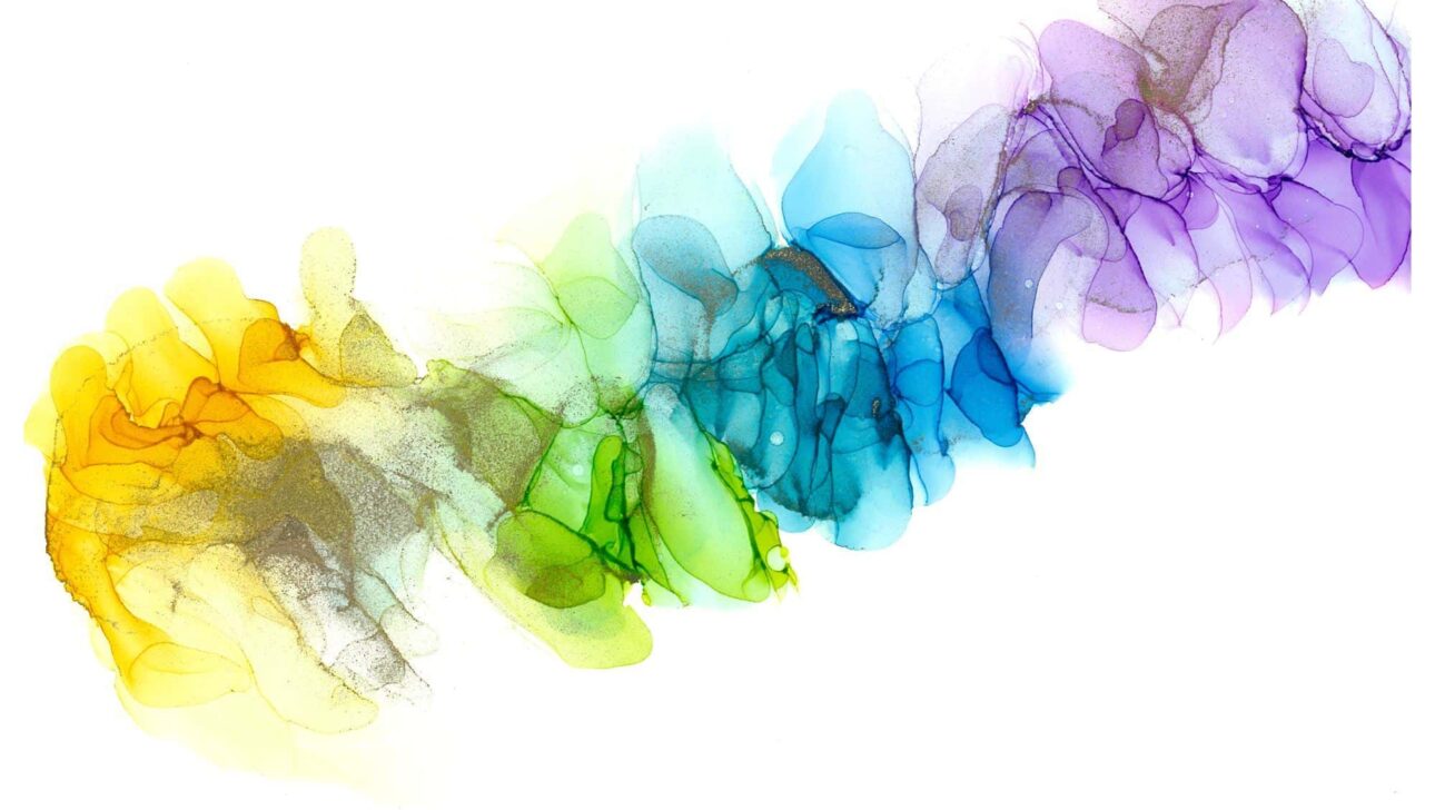 A rainbow colored smoke on a white background.
